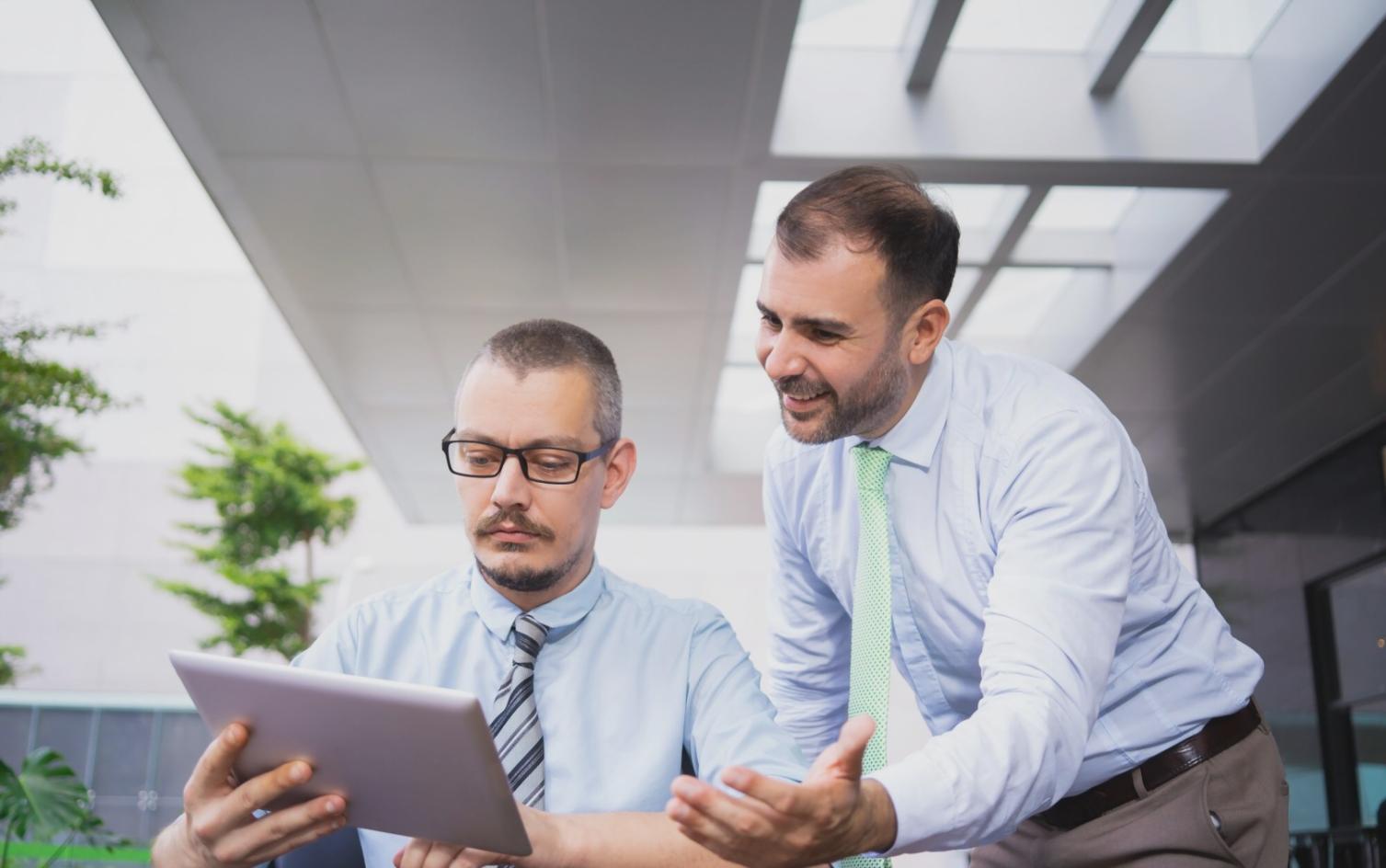 Budget planning worksheets and financial calculation tools spread on desk with calculator